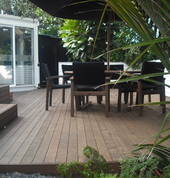A place to relax on the deck under the pohutakawa tree